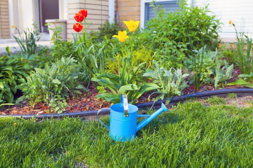 Professional landscapers maintaining a tidy and safe site