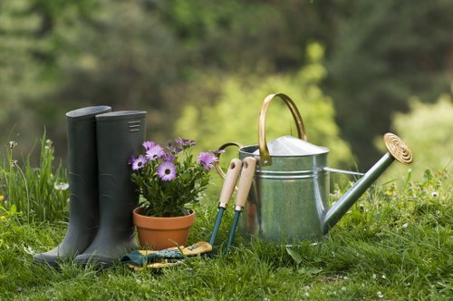 Stylish landscape gardening in Norbiton with a structured patio and planting